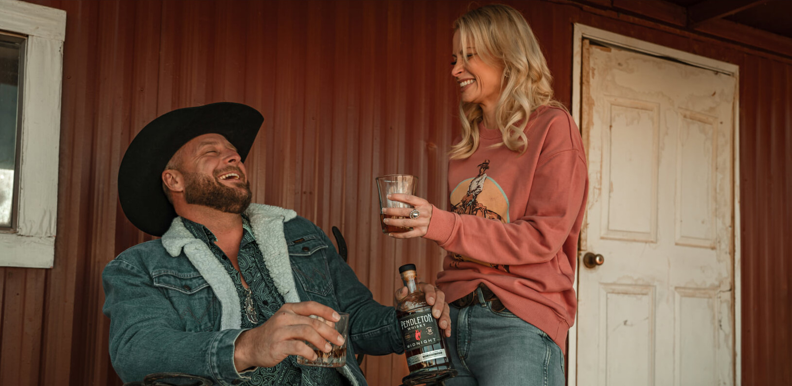 Cowboy and cowgirl drinking Pendleton Whisky Midnight